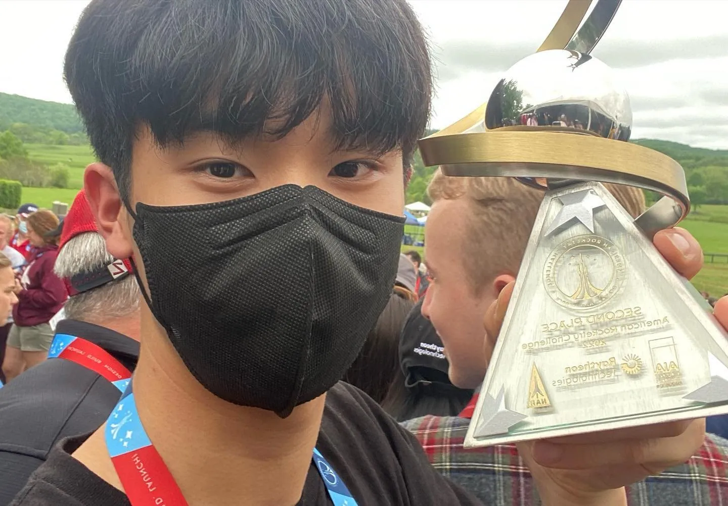 A team member holding the national championship trophy