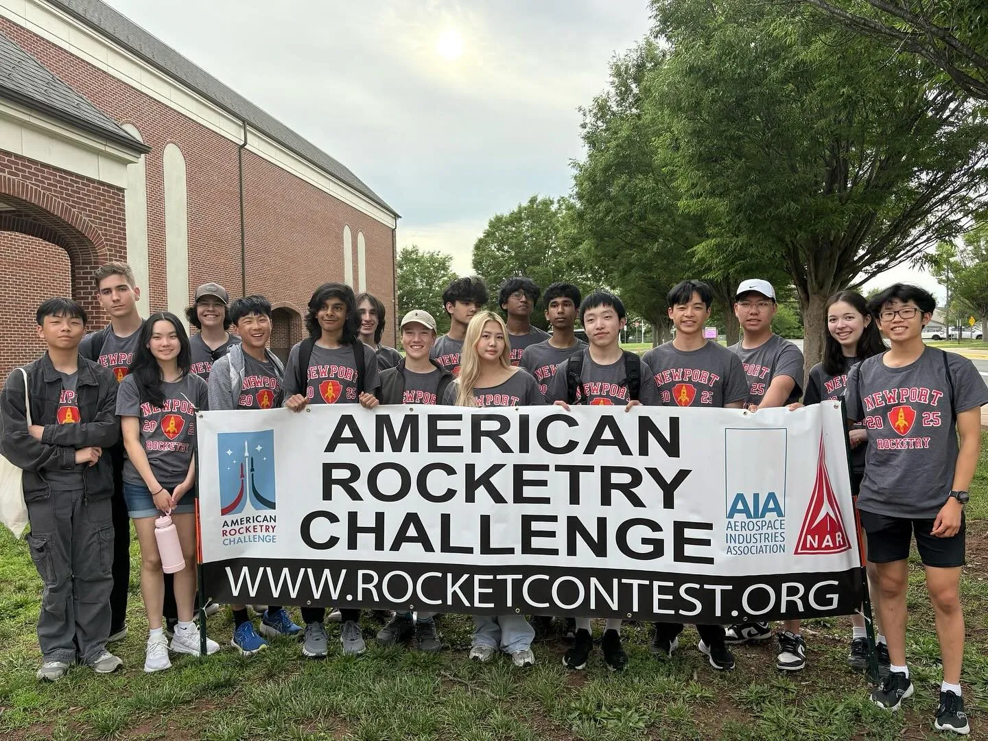 The Newport teams holding an American Rocketry Challenge banner
